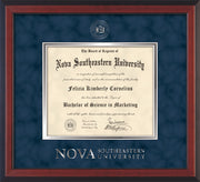 Image of Nova Southeastern University Diploma Frame - Cherry Reverse - w/Silver Embossed NSU Seal & Wordmark - Navy Suede on Silver mat